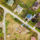 Aerial view of home roofs in residential rural neighborhood area.